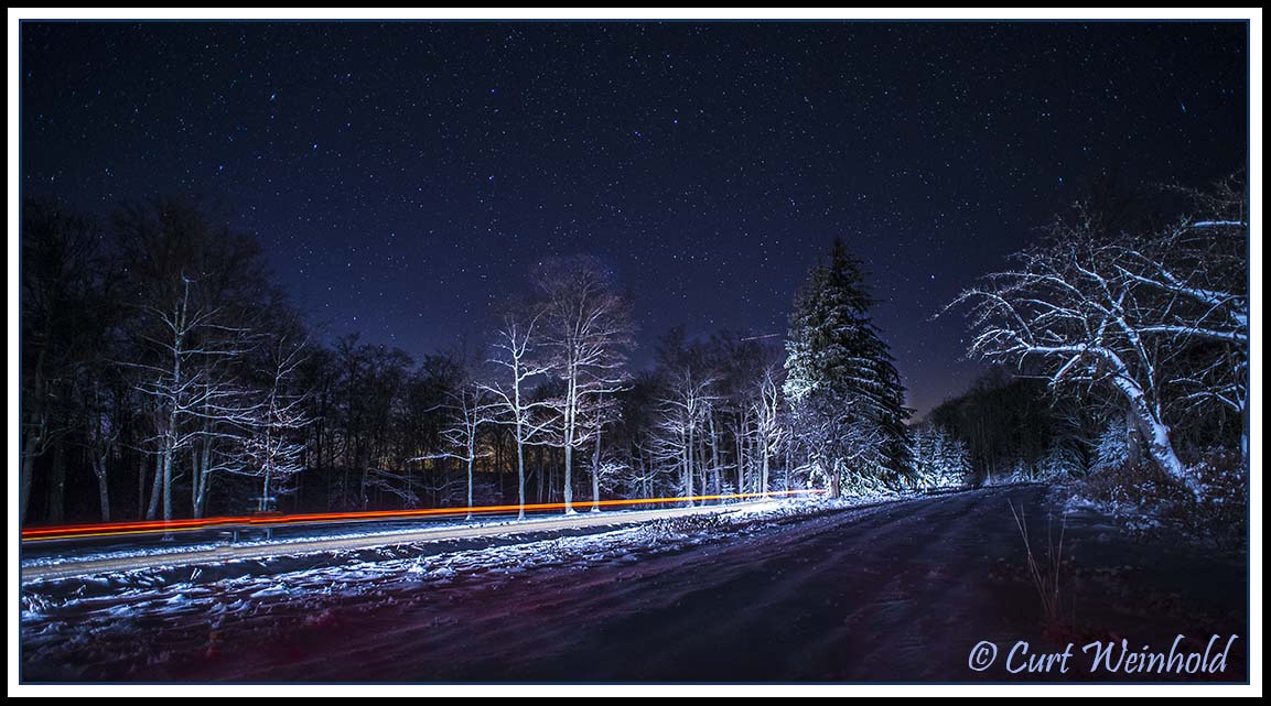 Streaked car lights & a starry sky