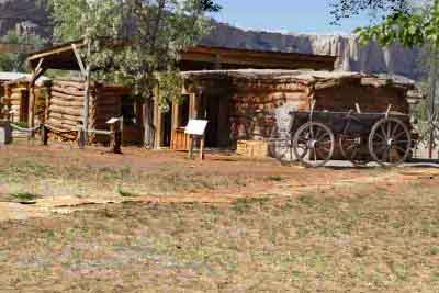 log house and wagon