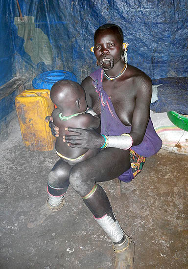 Surma woman with baby;  south-western Ethiopia.