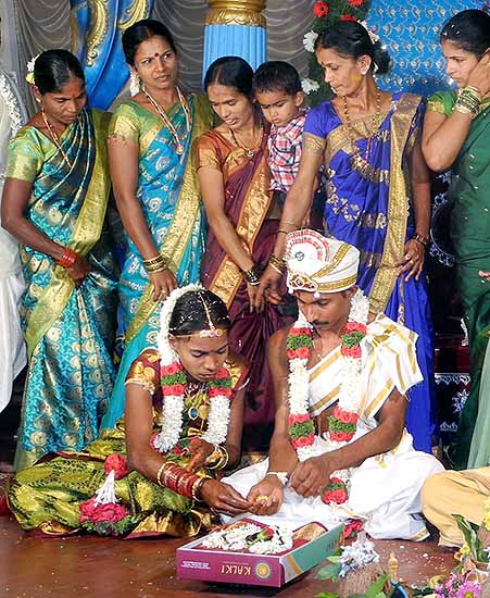 Bride and groom with his wedding presents; Wedding ceremony in Karnataka, India