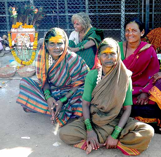 Devotees with brass bust of goddess Yellamma, Yellamma temple, Saundatti, Karnataka, India