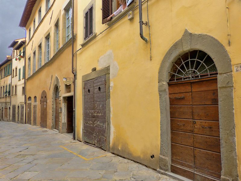 Walking along an old, empty street we left Arezzo...