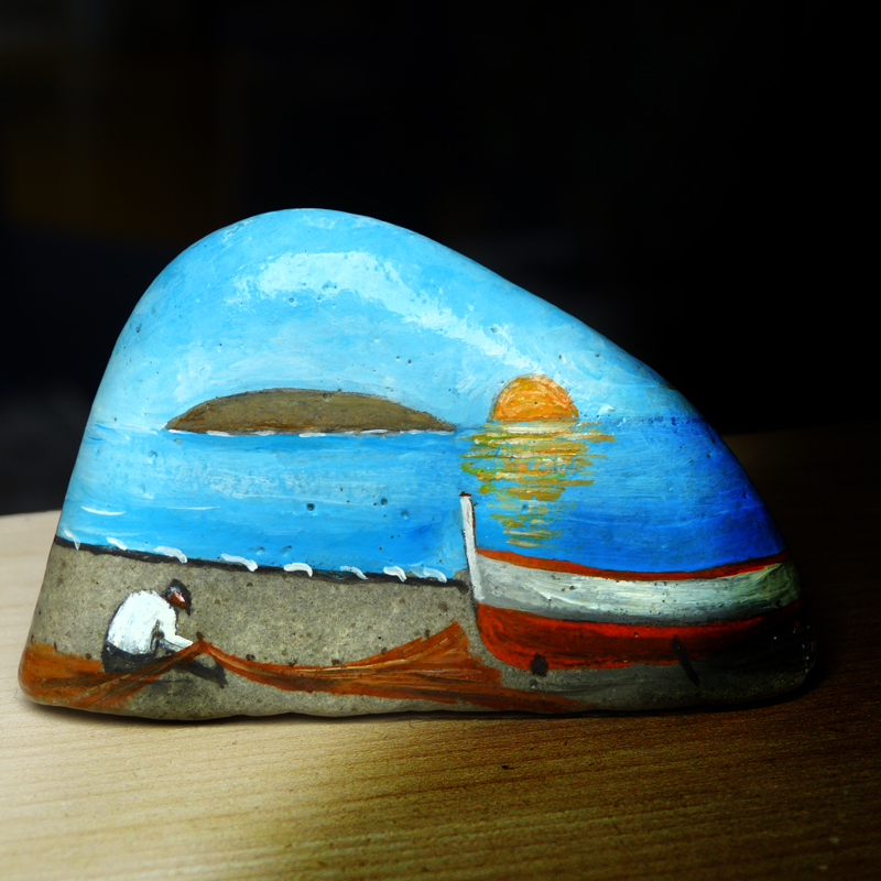An old man painted on stones...