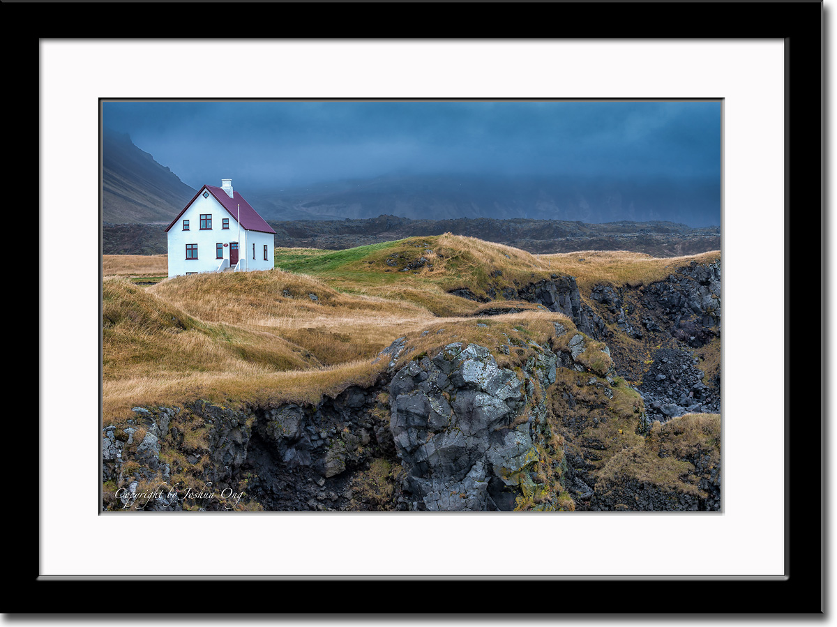 A House on the Rocky Cliff Above the Shore