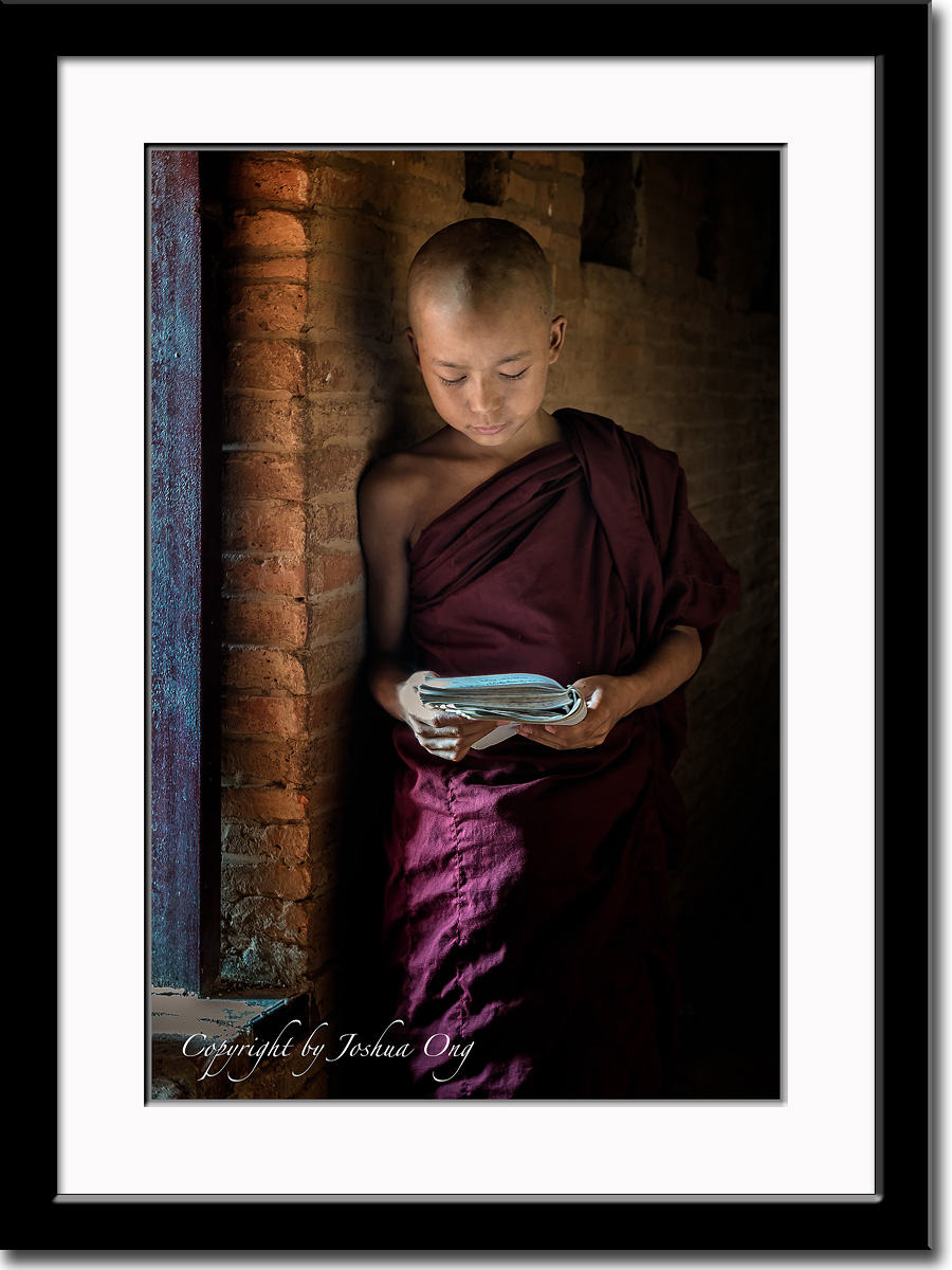 A novice monk reading a scripture