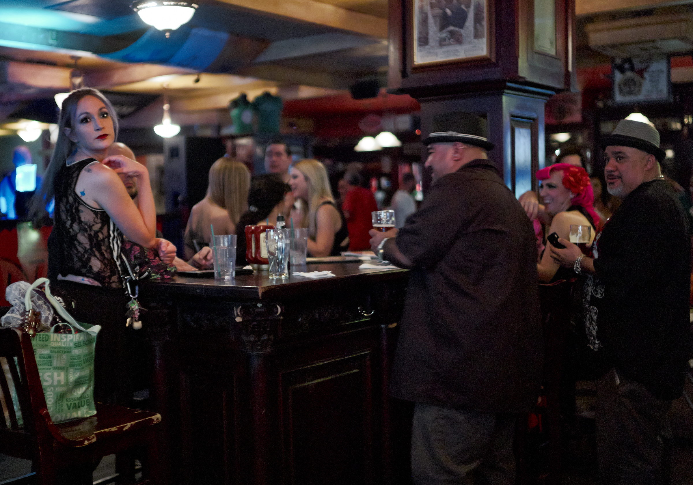 model at bar with security Tipout launch party