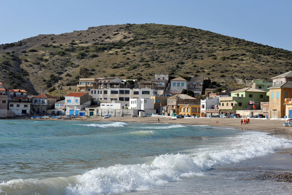 Gentle waves lapping against the sandy beach of Bouzedjar