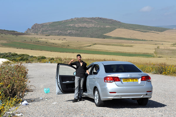 There's a giant parking area a few km west from Madagh II ... perhaps there's a trail to another beach