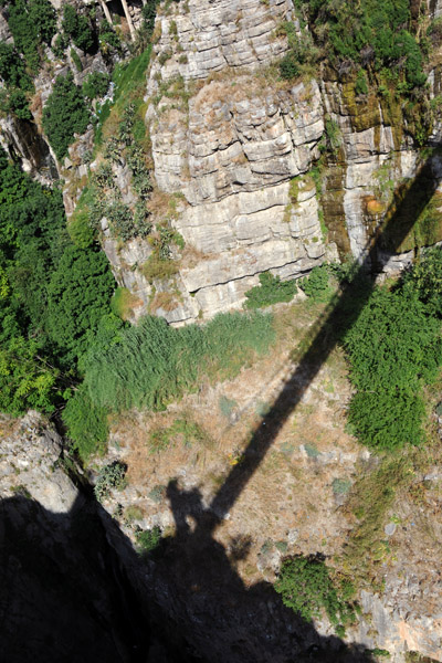 Shadow of the Mellah Slimane Bridge cast across the canyon