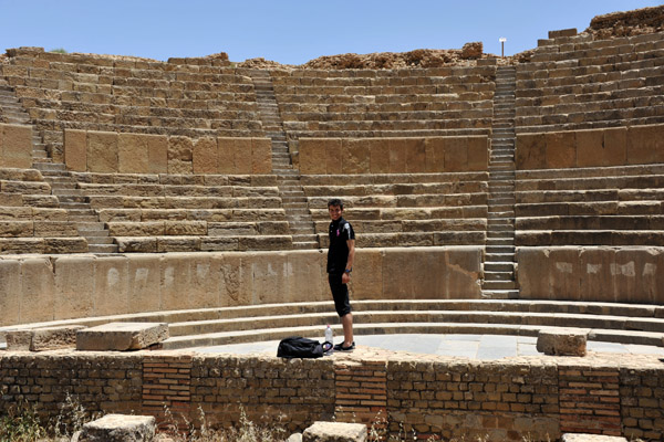 Zackaria on stage at the Roman Theatre, Timgad