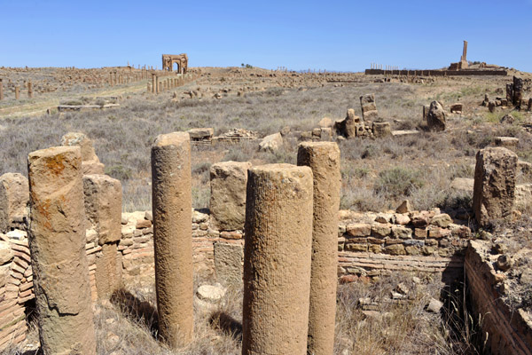 Ruins of Ancient Timgad with the prominent remains of the Capitol and Trajan's Arch