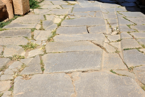 Grooves in the paving stones carved out by centuries of ancient chariot and wagon traffic