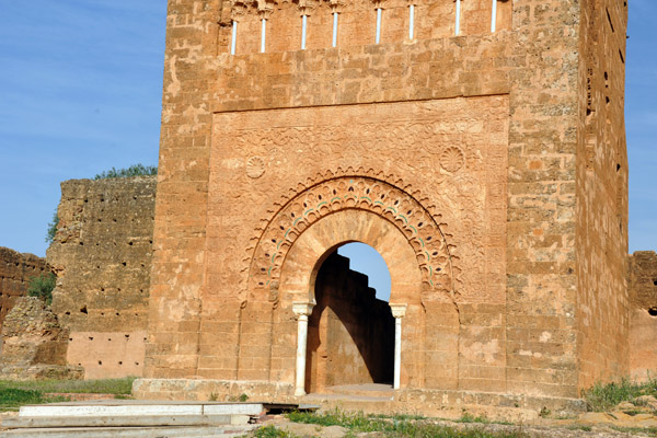 Entrance to the Mosque of Mansourah through an arch at the base of the massive minaret