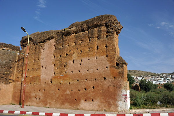 City walls split by the modern road leading to the city centre of Tlemcen