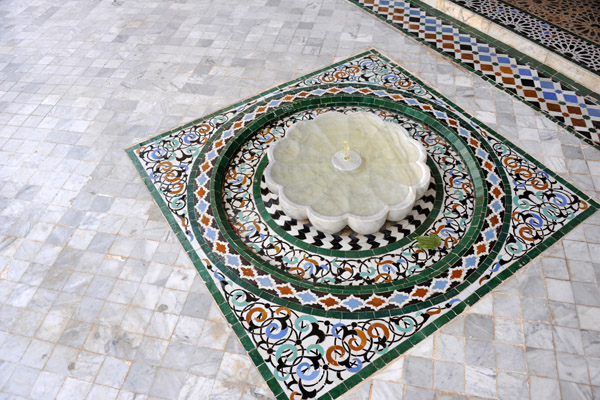 Another small fountain set in a floor of marble and tile, Mechouar Palace