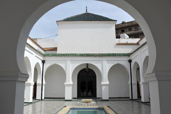 Courtyard of the Medrasa of Sidi Boumediene through the main entry arch