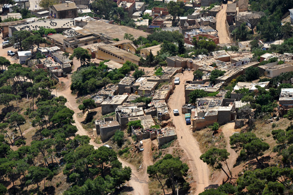 Dirt roads winding along the lower slopes of Jebel Murdjadjo