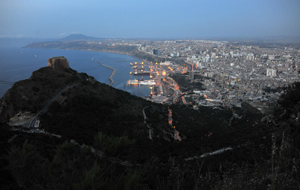 The lights of Oran start to come on - dusk at  Jebel Murdjadjo with the Fort of Santa Cruz