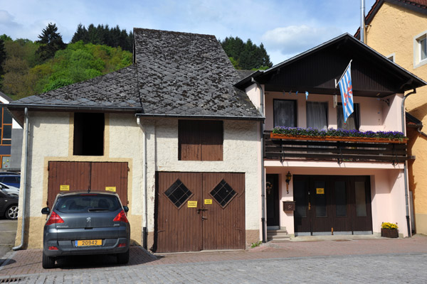 House in Vianden displaying the Ensign of Luxembourg