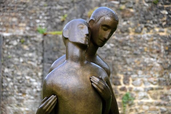 Entraide, modern sculpture inspired by the Good Samaritan by Camille Colruyt, 1961-1965