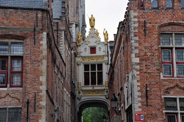 Blinde-Ezelstraat with the small bridge connecting the City Hall and the Courthouse, Bruges