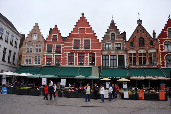 Row of terrace cafés on the north side of the Market Square of Bruges