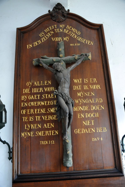 Crucifix with Biblical inscriptions inside the north gate of the Begijnjof