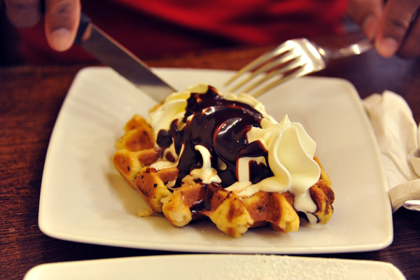 Belgian Waffle with whipped cream and chocolate sauce