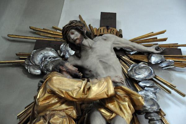 St. Francis putting his arms around Christ on the Cross