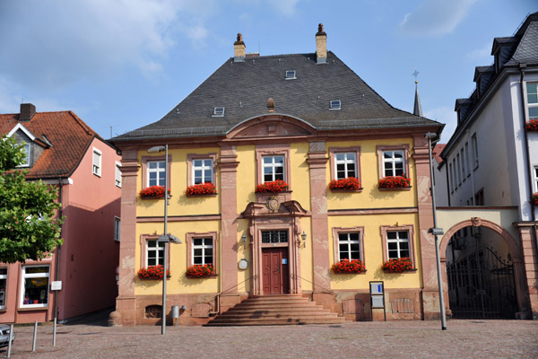 Yellow house with red sandstone trim next to the New Town Hall, Miltenberg