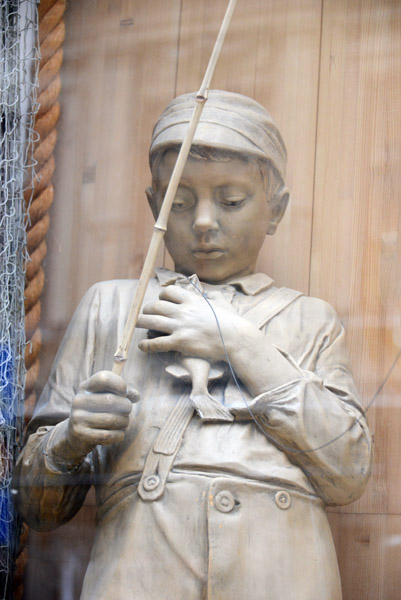 Sculpture of a Swedish boy who just caught a fish
