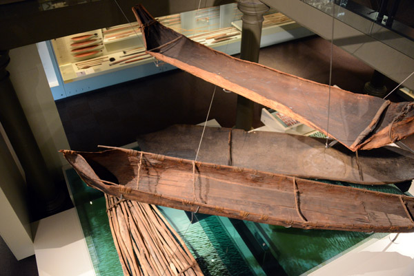 Looking down on the bark canoes on the ground floor