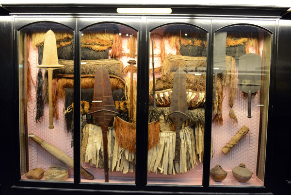 Victorian display case with artefacts from Fiji