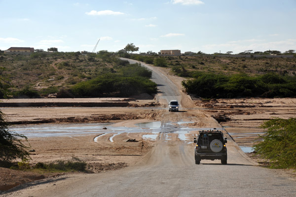 Some water crossing National Highway 1 at Daarbuduq