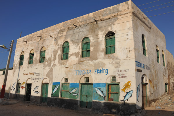 Small fishing companies occupy many of the old harborside buildings, Berbera