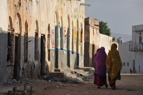 A pair of Somali woman walking through the Old City, Berbera