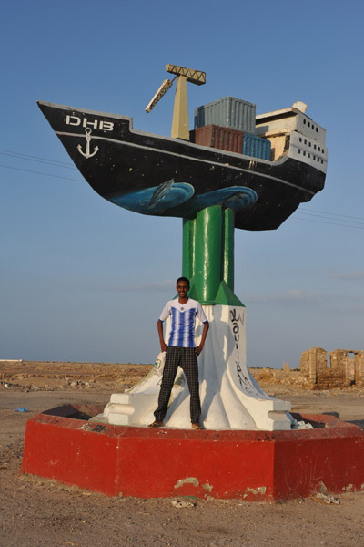 Somalilander posing with the ship monument