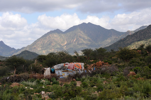 Modest dwelling at the base of the mountains