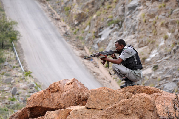 Somaliland Special Protection Unit (SPU) taking aim with his AK-47