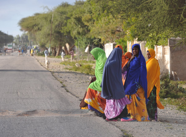Colorfully dressed group of Somali women by the roadside in Sheikh