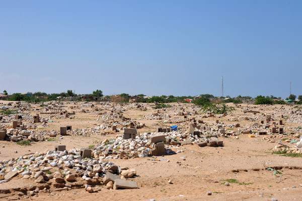 Cemetery in Berbera with graves marked by piles of stone and cinder blocks