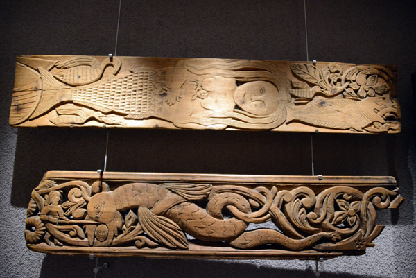 Carved wooden panel with a mermaid