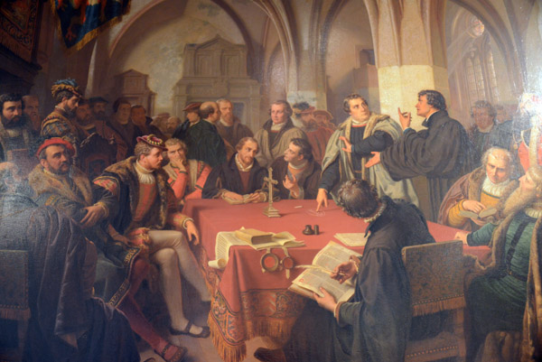 Marburg Colloquy, 1529, dispute between Martin Luther and Ulrich Zwingli over the presence of Christ in the Eucharist