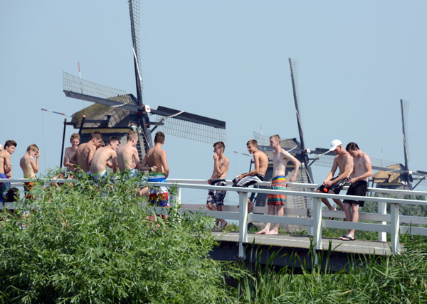 Dutch boys on a bridge at Kinderdijk on a warm July day