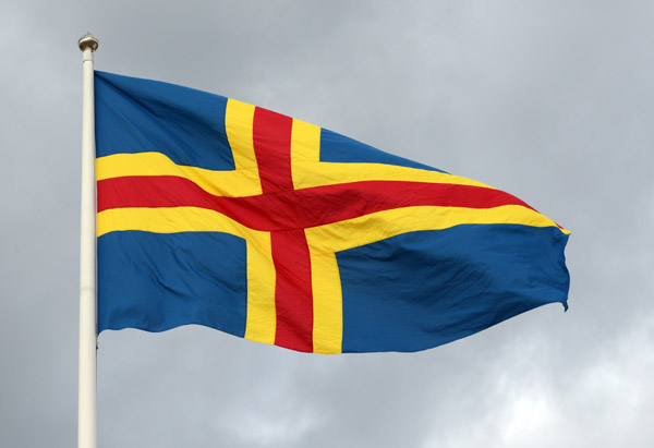 Flag of the land Islands adopted in 1954, the Swedish flag with an additional red cross