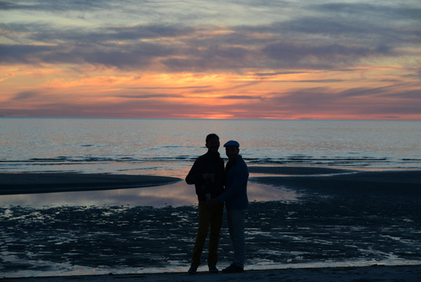 Couple on the beach at sunset, Ls