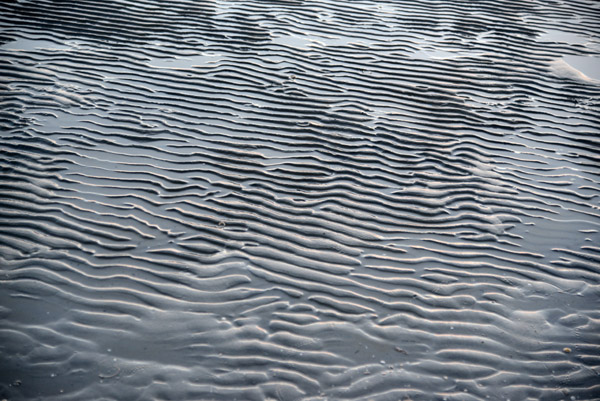 Wavy patters in the wet low tide sand, Ls