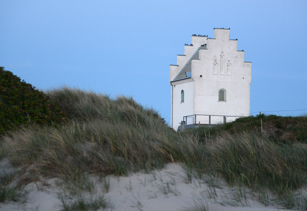 Old Danish-style church tower across the dunes, now a spa, Ls Kur