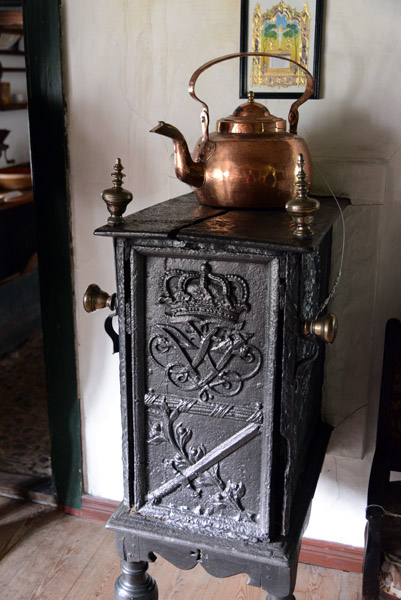 Cast iron stove with copper kettle and cypher of Frederik IX