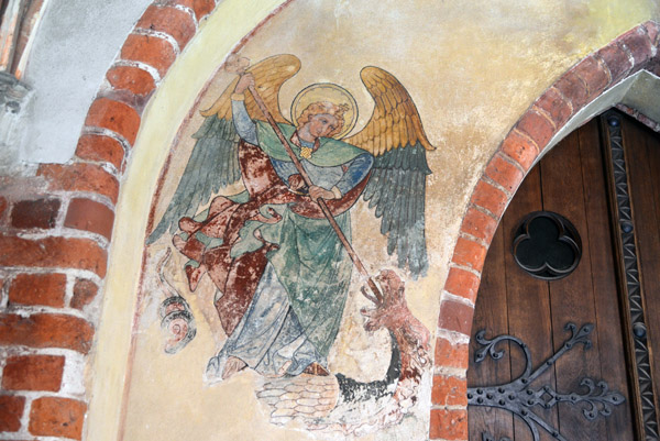 Mural of an angel spearing a dragon, High Castle, Malbork